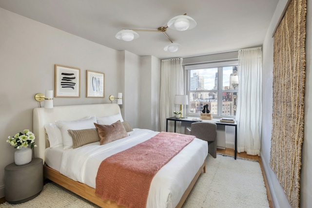 bedroom featuring light wood-style floors