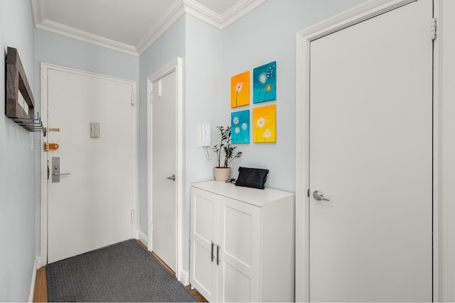 corridor with crown molding and baseboards