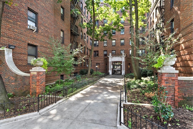 exterior space with brick siding and cooling unit