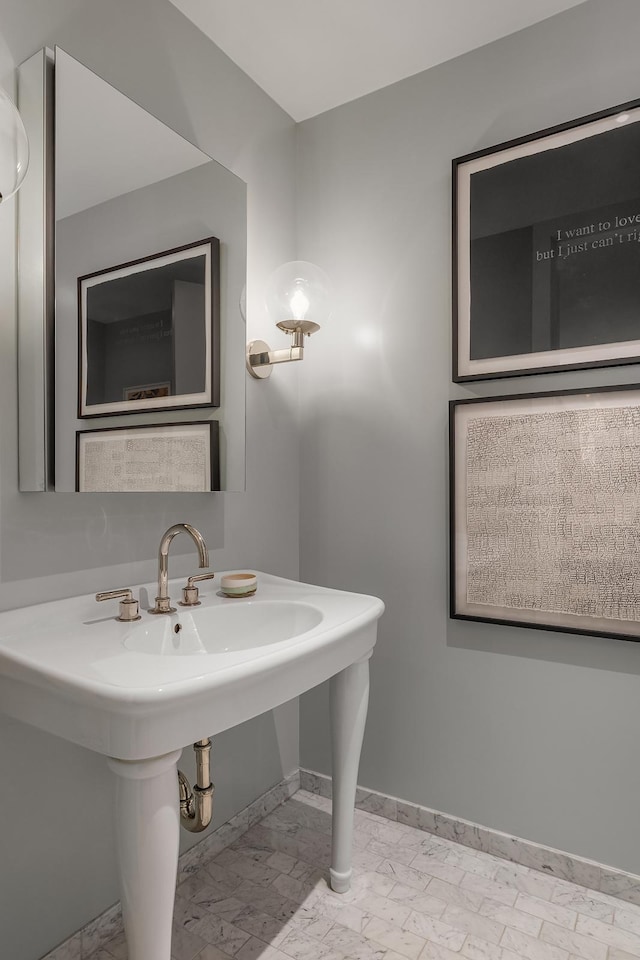 bathroom with baseboards