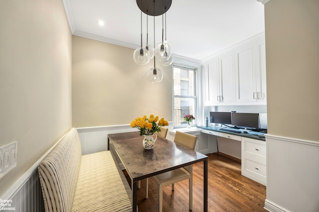 180 Riverside Dr Unit 3E, New York City, NY 10024 - dining room featuring built in study area, dark wood finished floors, crown molding, and wainscoting