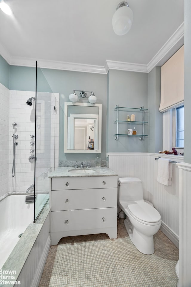 180 Riverside Dr Unit 3E, New York City, NY 10024 - bathroom with ornamental molding, tiled shower / bath, vanity, a wainscoted wall, and tile patterned floors