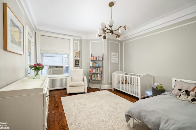 180 Riverside Dr Unit 3E, New York City, NY 10024 - bedroom featuring radiator heating unit, a chandelier, dark wood-type flooring, cooling unit, and ornamental molding