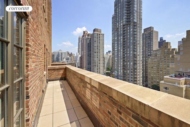 balcony featuring a view of city