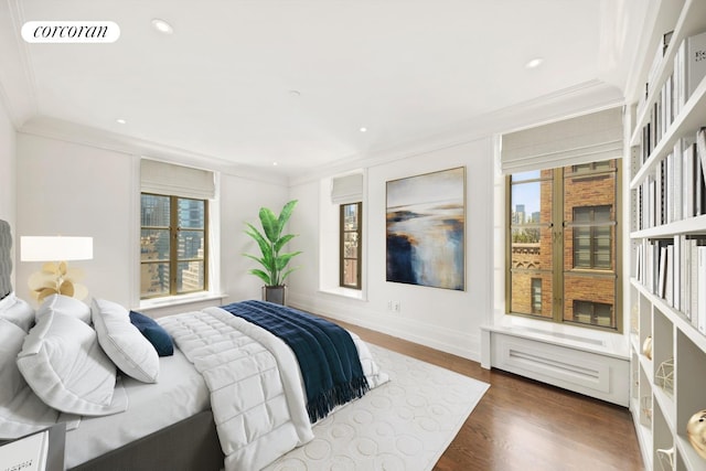 bedroom with visible vents, ornamental molding, dark wood-style flooring, baseboards, and recessed lighting