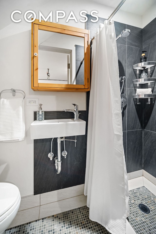 65 Jackson St, New York City, NY 11211 - full bath with a shower stall and tile patterned flooring