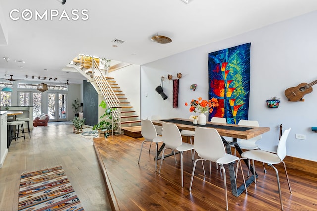 65 Jackson St, New York City, NY 11211 - dining room featuring stairs and hardwood / wood-style floors