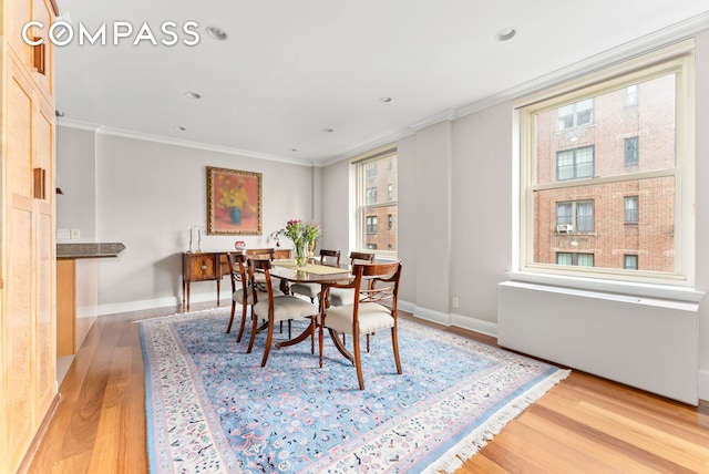 112 E 83rd St Unit 6C, New York City, NY 10028 - dining space featuring light wood-style floors, ornamental molding, baseboards, and recessed lighting