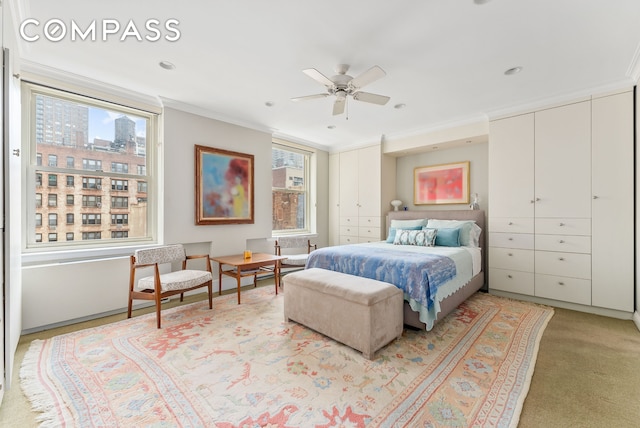 112 E 83rd St Unit 6C, New York City, NY 10028 - bedroom featuring two closets, crown molding, light carpet, a ceiling fan, and recessed lighting