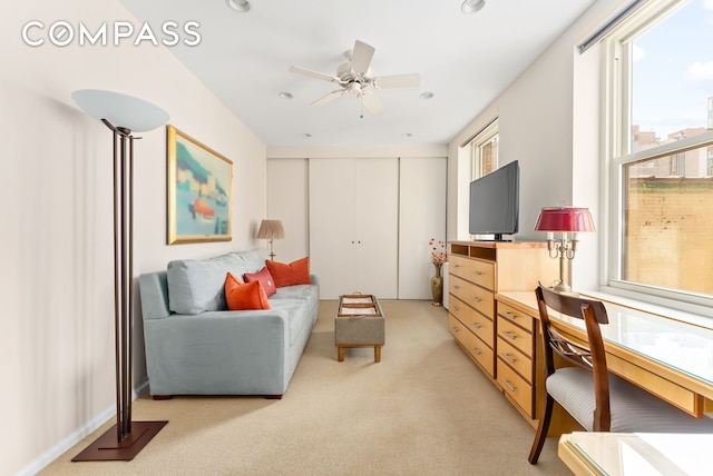 112 E 83rd St Unit 6C, New York City, NY 10028 - living area with a desk, a ceiling fan, light carpet, and recessed lighting