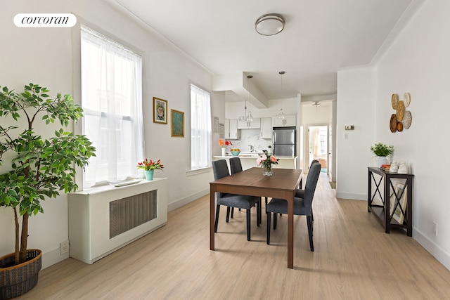 152 Senator St, New York City, NY 11220 - dining space featuring light wood-style flooring and baseboards