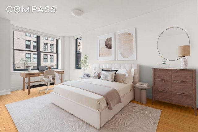 199 State St Unit 4C, New York City, NY 11201 - bedroom with hardwood / wood-style flooring, a desk, and multiple windows
