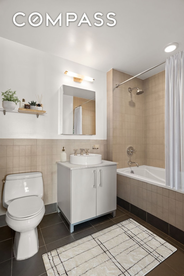 199 State St Unit 4C, New York City, NY 11201 - full bathroom featuring tile patterned floors, tile walls, toilet, tiled shower / bath combo, and vanity