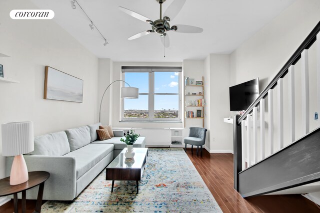 96 Schermerhorn St Phc, Phc, New York City, NY 11201 - living area featuring track lighting, ceiling fan, stairs, dark wood-style flooring, and baseboards