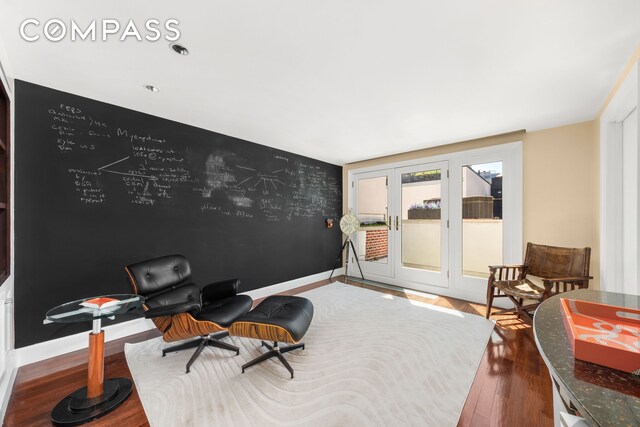 11 Vestry St Ph, Ph, New York City, NY 10013 - bedroom with dark wood finished floors, french doors, an accent wall, baseboards, and access to exterior
