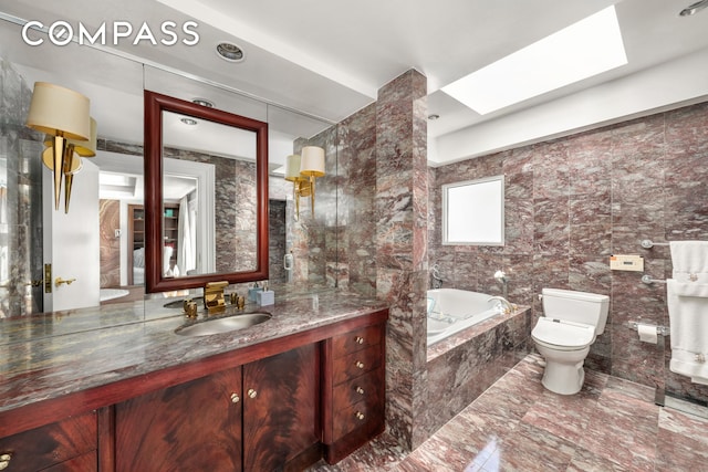11 Vestry St Ph, Ph, New York City, NY 10013 - full bathroom featuring a garden tub, toilet, vanity, tile walls, and marble finish floors