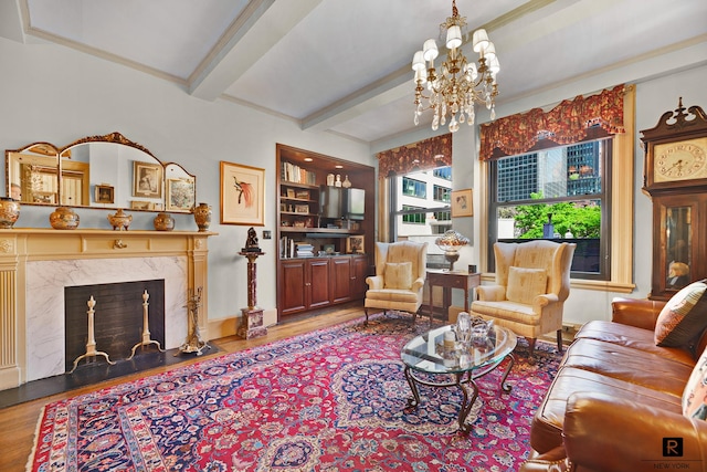 212 E 48th St Unit 5-C, New York City, NY 10017 - living area with wood finished floors, a chandelier, beamed ceiling, and a fireplace