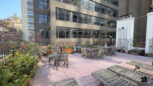 view of patio featuring fence