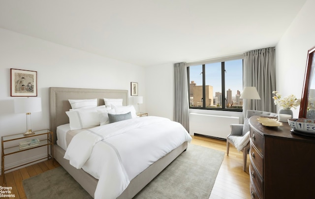 bedroom featuring light wood-style floors