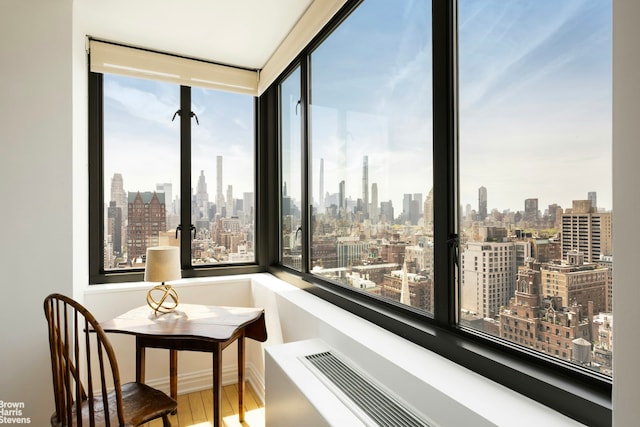 sunroom featuring a view of city