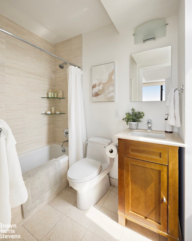 bathroom featuring shower / bath combo with shower curtain, tile patterned floors, toilet, and vanity