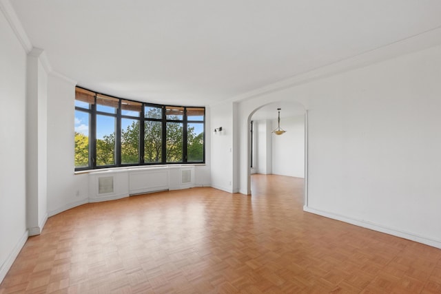 222 Riverside Dr Unit 5A, New York City, NY 10025 - unfurnished room with arched walkways, baseboards, and crown molding