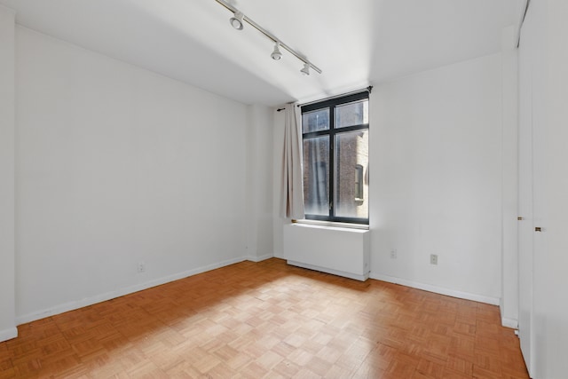 222 Riverside Dr Unit 5A, New York City, NY 10025 - empty room with rail lighting, baseboards, and radiator