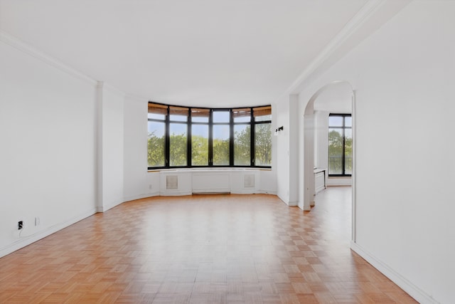 222 Riverside Dr Unit 5A, New York City, NY 10025 - unfurnished room featuring arched walkways, baseboards, and ornamental molding