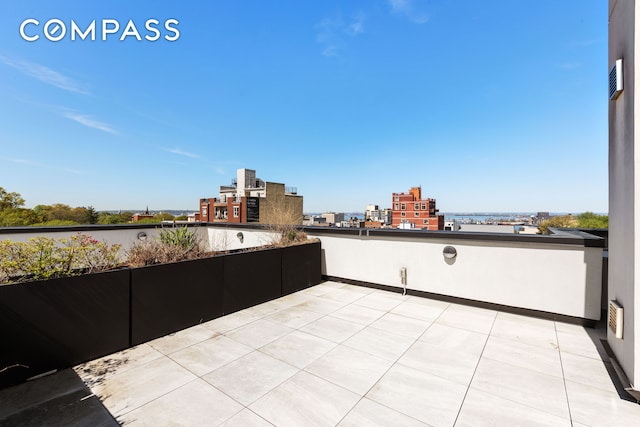 view of patio with a city view