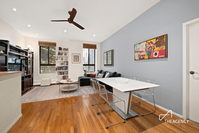 dining space with a ceiling fan, baseboards, recessed lighting, and wood finished floors