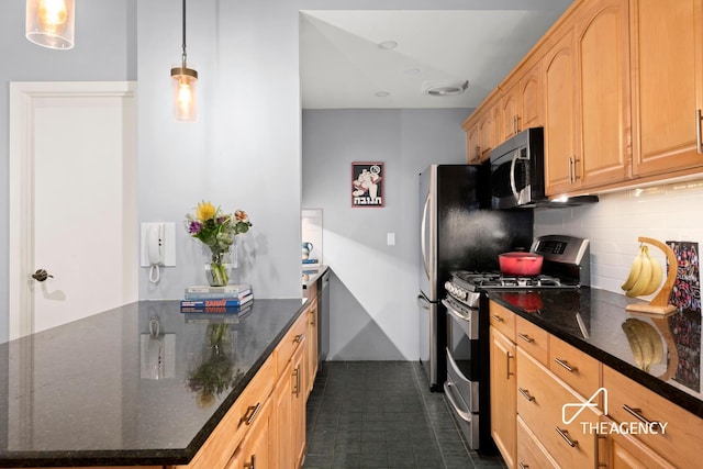 kitchen with light brown cabinets, dark stone counters, appliances with stainless steel finishes, backsplash, and decorative light fixtures