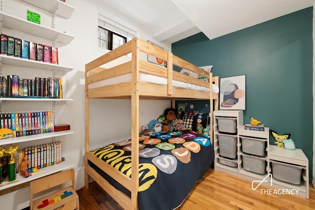bedroom featuring wood finished floors