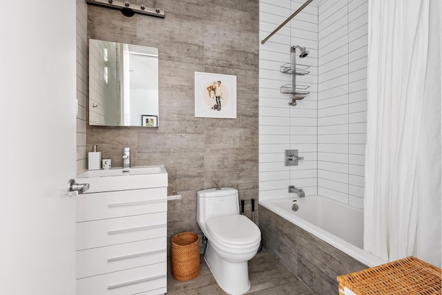 full bath with vanity, tiled shower / bath, and toilet