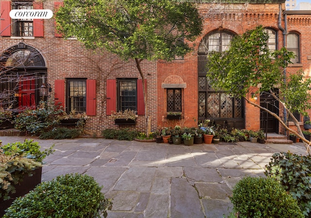 exterior space with brick siding