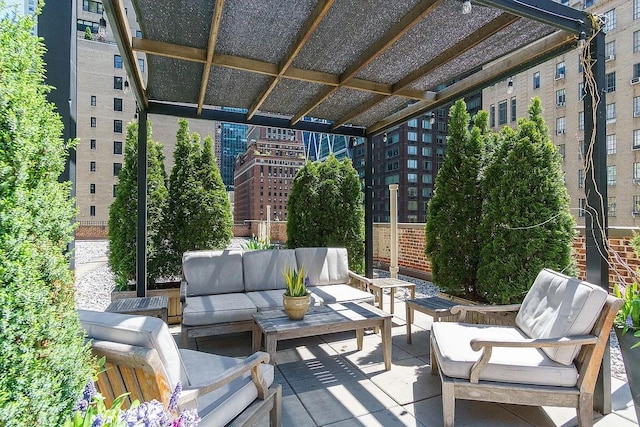 view of patio / terrace with a view of city and an outdoor living space