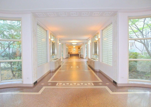hall featuring baseboards