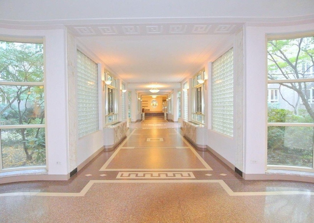 hallway featuring baseboards
