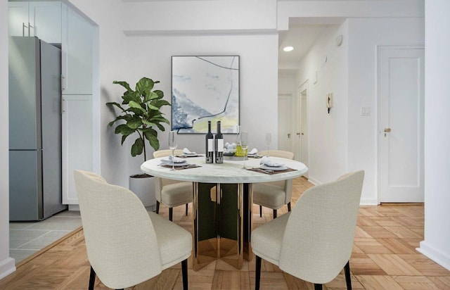 dining room with recessed lighting