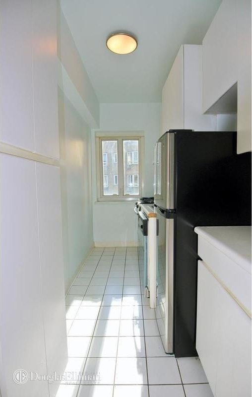 interior space with light tile patterned flooring