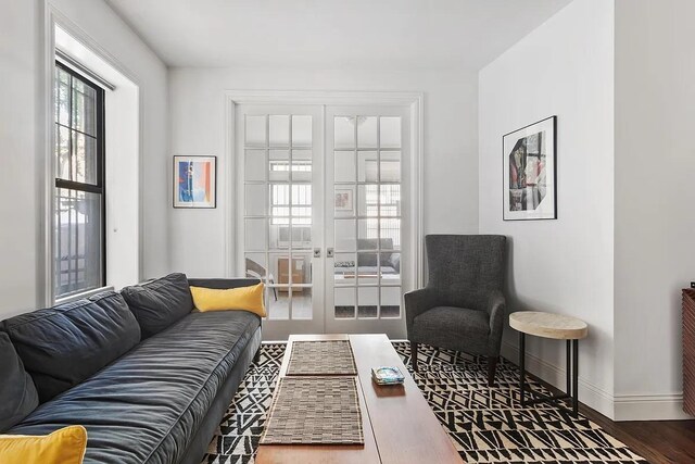 3117 Broadway Unit 1, New York City, NY 10027 - living area featuring baseboards, wood finished floors, and french doors