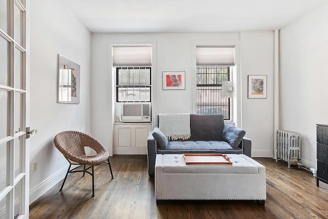 3117 Broadway Unit 1, New York City, NY 10027 - living room featuring radiator, cooling unit, dark wood finished floors, and baseboards