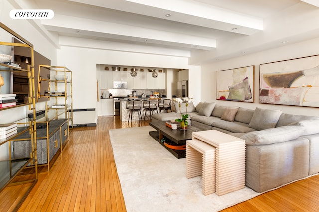 living room featuring light wood finished floors and visible vents