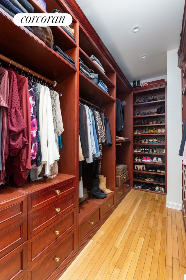 walk in closet featuring light wood-style floors