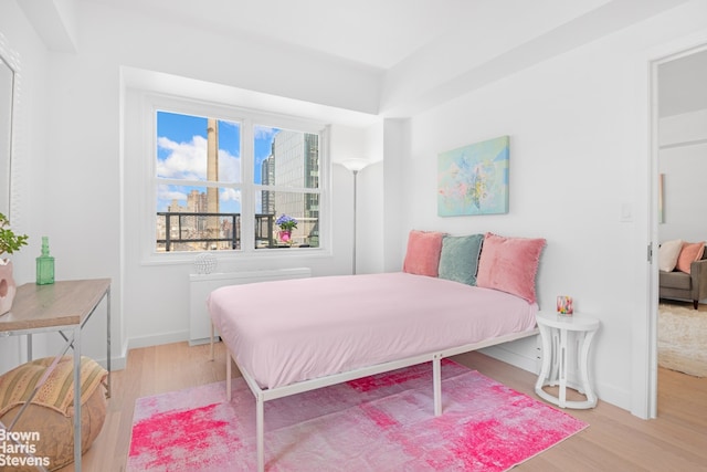 520 E 72nd St Pha, Pha, New York City, NY 10021 - bedroom with wood finished floors, baseboards, and radiator heating unit