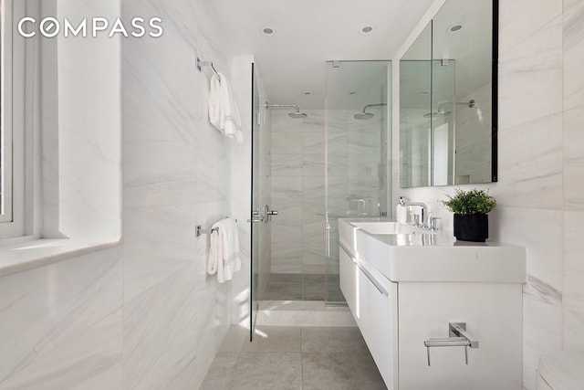 166 E 63rd St Unit 11Bc, New York City, NY 10065 - full bath with a shower stall, vanity, and tile patterned floors