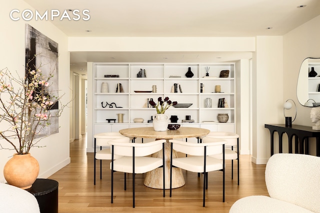 166 E 63rd St Unit 11Bc, New York City, NY 10065 - dining area with light wood-type flooring and baseboards