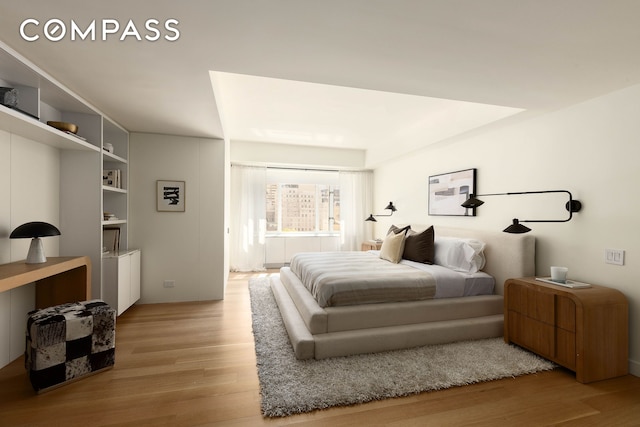 166 E 63rd St Unit 11Bc, New York City, NY 10065 - bedroom featuring light wood-style flooring