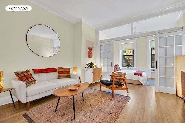 330 W 17th St Unit 2E, New York City, NY 10011 - living area featuring light wood-style floors and ornamental molding