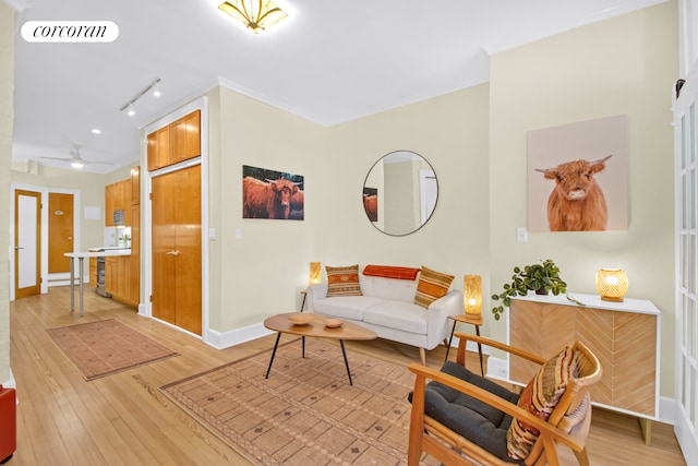330 W 17th St Unit 2E, New York City, NY 10011 - living area with light wood-style floors, rail lighting, and a ceiling fan