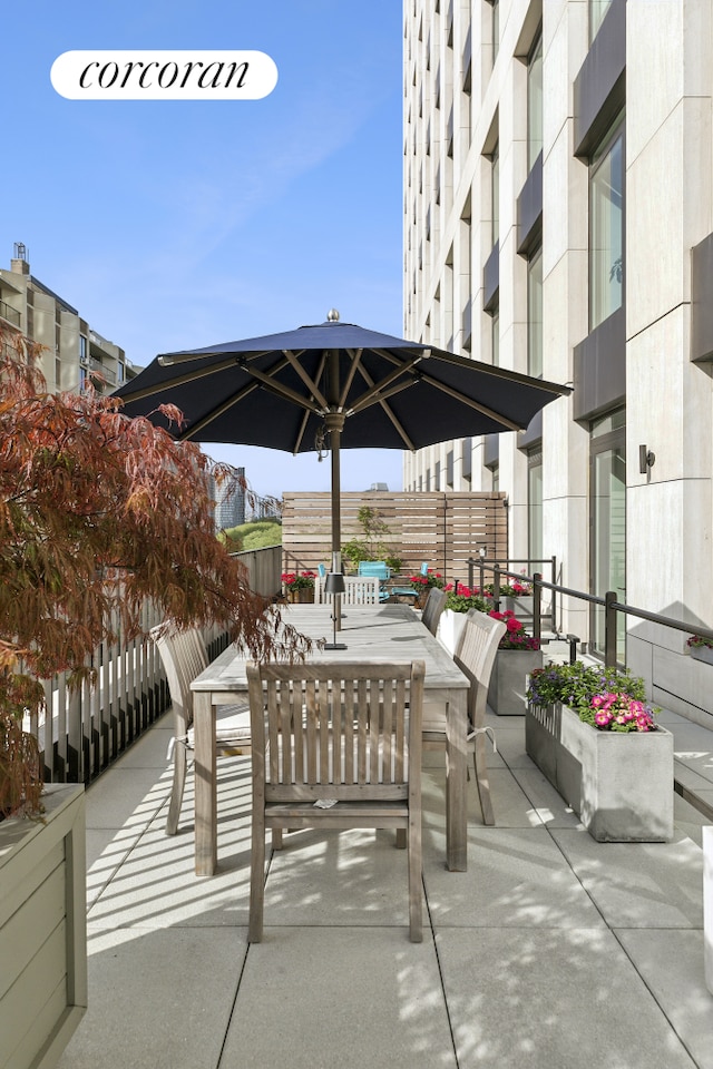 view of patio featuring outdoor dining area